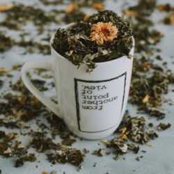 white and brown ceramic mug